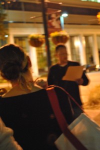 McManus reads on the corner of Lady and Main Streets