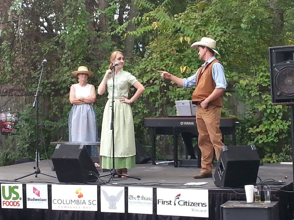Kathy Hartzog, Haley Sprankle, and Bryan performing a scene from "Oklahoma!" at the Rosewood Arts Festival
